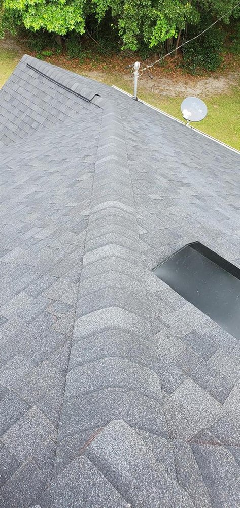 Slide of SE Roofing and Construction