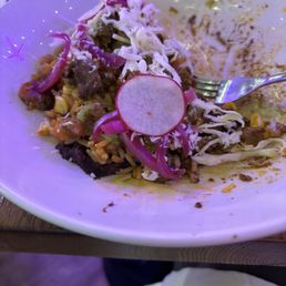 Half eaten burrito as a bowl