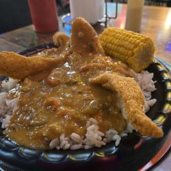 Crawfish etouffee with catfish on rice special