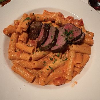 Russell's Steaks Chops & More - New York Strip, Prime over pasta - Steakhouses Near Me - Williamsville, New York Russell's Steaks Chops & More - New York Strip, Prime over pasta - Steakhouses Near Me - Williamsville, New York