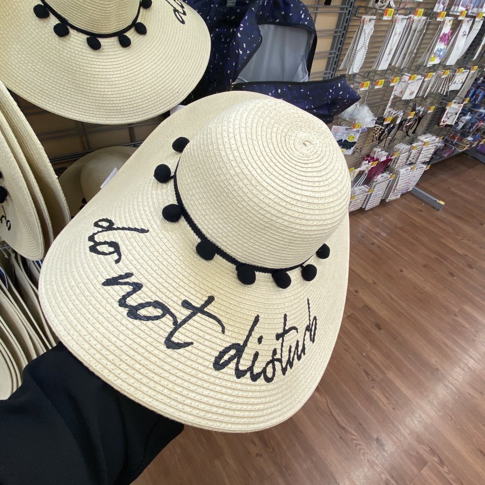 a person holding a hat a person holding a hat
