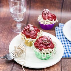 Em’s Cakes & Bakery - April Fool's cupcakes w/custom Spaghetti & strawberry sauce design