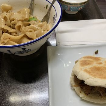 Uncle Zhou - Dial Oil Hand-Drawn Wide Noodle, Chinese Hamburger (Beef). Hamburger was good but kinda small for the price. - Chinese Near Me - Plano, Texas Uncle Zhou - Dial Oil Hand-Drawn Wide Noodle, Chinese Hamburger (Beef). Hamburger was good but kinda small for the price. - Chinese Near Me - Plano, Texas