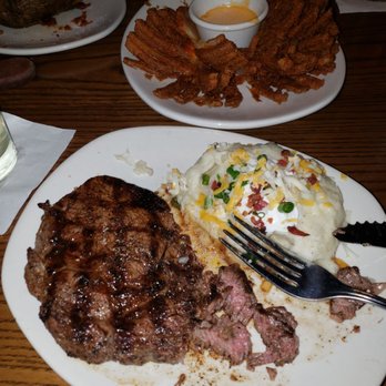 Outback Steakhouse - Feasting after a while with a stomach bug! Yum steak is cooked as requested Free blooming onion. - Steakhouses Near Me - Merrillville, Indiana