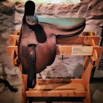 Belair Stable Museum - saddle on wood display - Museums Near Me - Bowie, Maryland