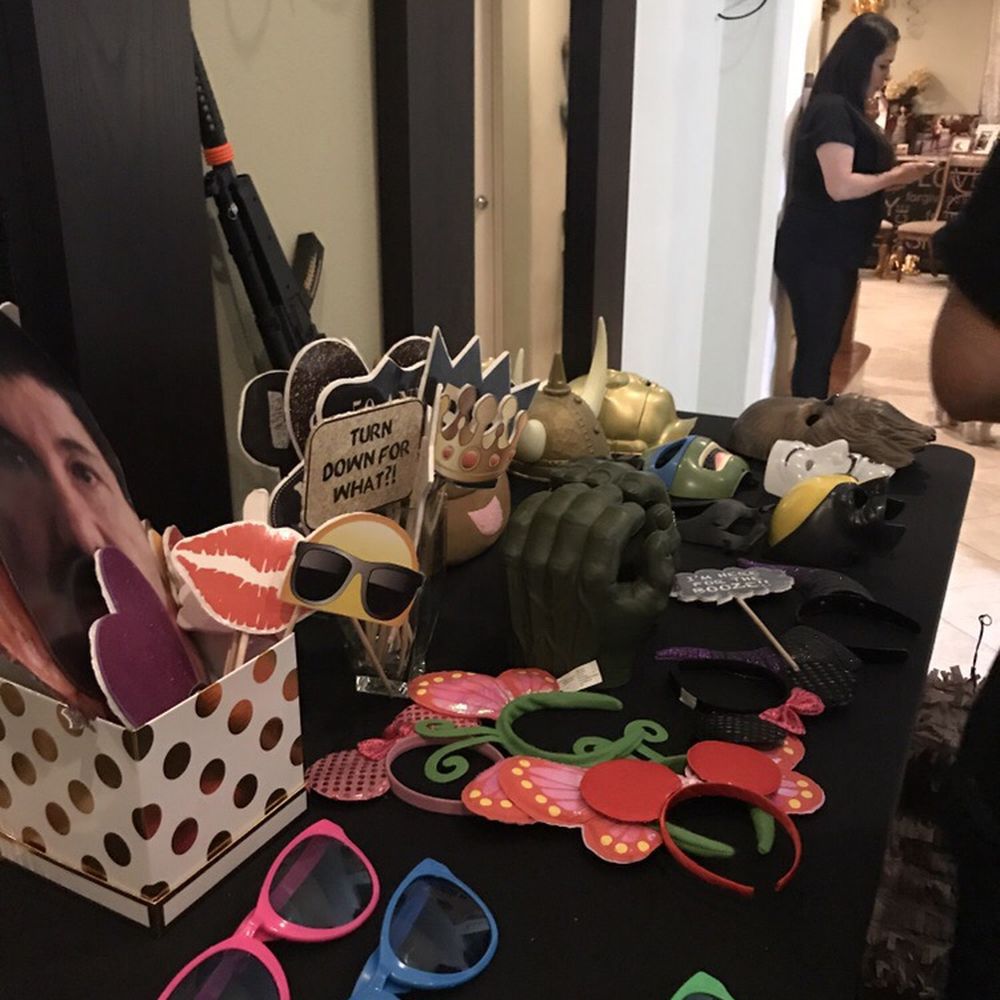 AG Photobooth - Variety of props ..and always kept neat and organized..faces like El Chapo, Trump, and others. - Photo Booth Rentals Near Me