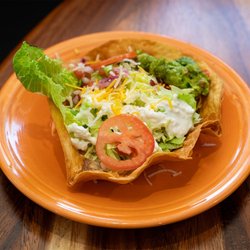 Cocina & Cantinamexican Grill - A taco salad presented in a fried tortilla bowl with guacamole and sour cream at Cocina&Cantina in Loveland.
