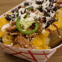 Over the Coles BBQ - Loaded potato our Saturday special ! As well as our daily menu!