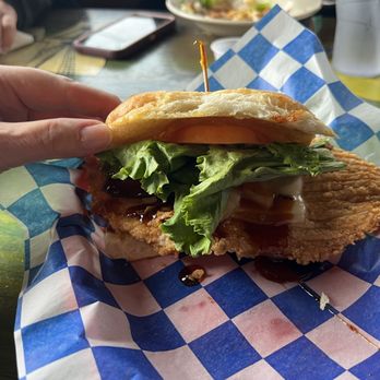 Pirate's Landing - Half of a Caribbean chicken sandwich with waffle fries - Seafood Near Me - Port Isabel, Texas