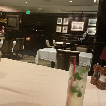 Hy's Steak House - Seen Employee cleaning tables and chairs after guests leaves - Steakhouses Near Me - Honolulu, Hawaii