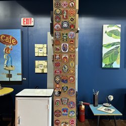Canto 34 Coffee Lounge - Shop is across the street for the local fire dept and there are many fire patches on a wall.... Very respectful.