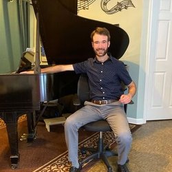 PianoMusicality - Colin with the Steinway and Sons grand piano on which he teaches
