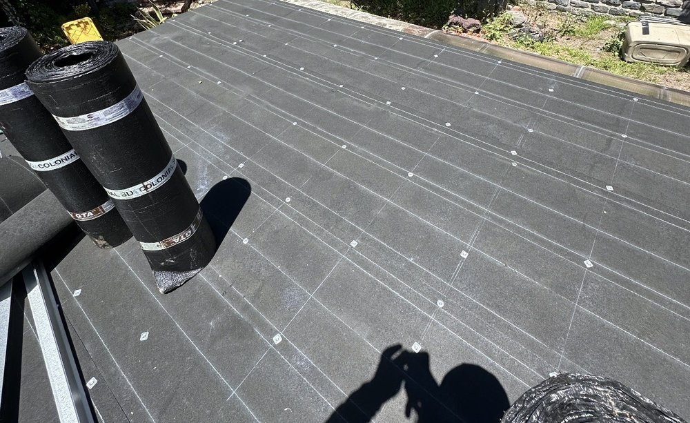 Slide of Rene’s Roofing