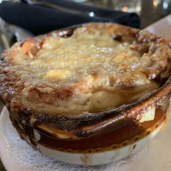 The Gryphon - French Onion Soup with a chunk of bread and cheese floating in the oniony goodness. - New American Near Me - Burlington, Vermont The Gryphon - French Onion Soup with a chunk of bread and cheese floating in the oniony goodness. - New American Near Me - Burlington, Vermont