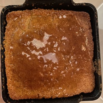 Sharps Roasthouse - Complimentary sourdough cornbread topped with maple syrup - American Near Me - SeaTac, Washington