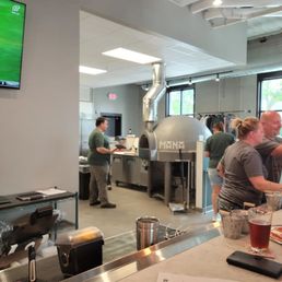 a group of people working in a brewery