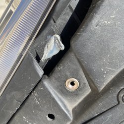 Panel Craft - More silicone / hot glue used to repair a headlight tab - so where's the tab , never screwed in & missing use glue lots and lots of glue!