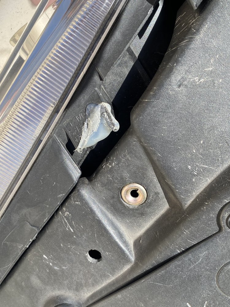 Panel Craft - More silicone / hot glue used to repair a headlight tab - so where's the tab , never screwed in & missing use glue lots and lots of glue! - Body Shops Near Me - Berkeley, California Panel Craft - More silicone / hot glue used to repair a headlight tab - so where's the tab , never screwed in & missing use glue lots and lots of glue! - Body Shops Near Me - Berkeley, California