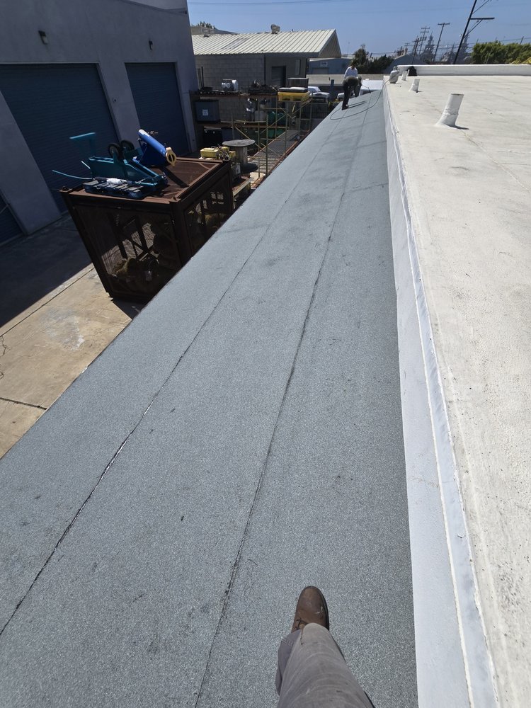 Slide of J&E Roofing Services