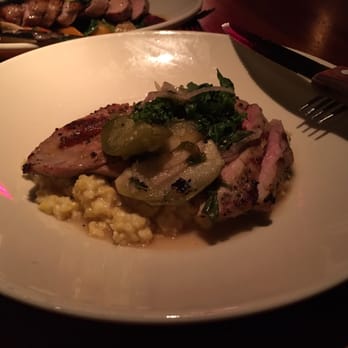 Whiskey Cake - Pork brisket steak cooked medium with grits. - New American Near Me - Plano, Texas Whiskey Cake - Pork brisket steak cooked medium with grits. - New American Near Me - Plano, Texas