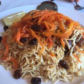 Kabul House - Kabuli Palau, the national dish of Afghanistan... lamb shank served under a bed of basmati rice with raisins and caramelized carrots - Afghan Near Me - Evanston, Illinois Kabul House - Kabuli Palau, the national dish of Afghanistan... lamb shank served under a bed of basmati rice with raisins and caramelized carrots - Afghan Near Me - Evanston, Illinois