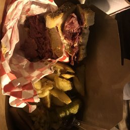 a sandwich with pickles and a pickle a sandwich with pickles and a pickle