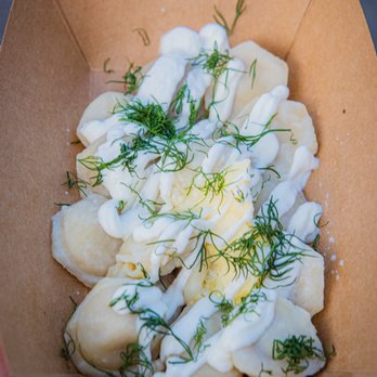 Backdoor Dumplings - a person holding a box of dumplings - Russian Near Me Backdoor Dumplings - a person holding a box of dumplings - Russian Near Me