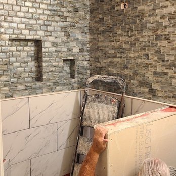 First Class Home Improvement Service - a man working on a bathroom - Flooring Near Me - Santa Fe, Texas First Class Home Improvement Service - a man working on a bathroom - Flooring Near Me - Santa Fe, Texas