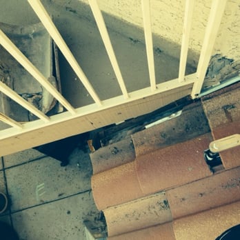 Tesla Energy - In this pic you can see that 2 tiles were removed by Solar City and needlessly left on my balcony... - Solar Installation Near Me Tesla Energy - In this pic you can see that 2 tiles were removed by Solar City and needlessly left on my balcony... - Solar Installation Near Me