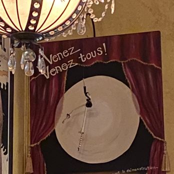 Le Troquet - Chandelier and cool art work - French Near Me - Albuquerque, New Mexico