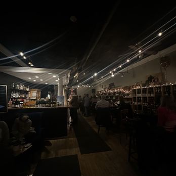 Bliss Wine Lounge - Main seating area. Look at all those bottles!! - Wine Bars Near Me - Wauconda, Illinois
