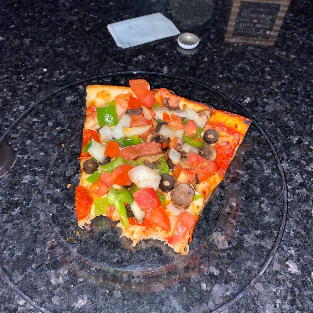 I have 4 slices of this raw toppings on top of already baked pizza I have 4 slices of this raw toppings on top of already baked pizza