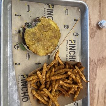 PINCHO - Tostones burger w/Cajun fries. - Latin American Near Me - Cypress, Texas PINCHO - Tostones burger w/Cajun fries. - Latin American Near Me - Cypress, Texas