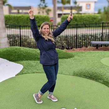 PopStroke - a woman on a miniature golf course - Mini Golf Near Me - Fort Myers, Florida PopStroke - a woman on a miniature golf course - Mini Golf Near Me - Fort Myers, Florida