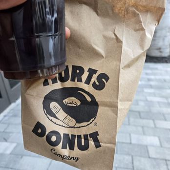 Hurts Donut - The take.. 2 donuts and coffee - Donuts Near Me - Plantation, Florida