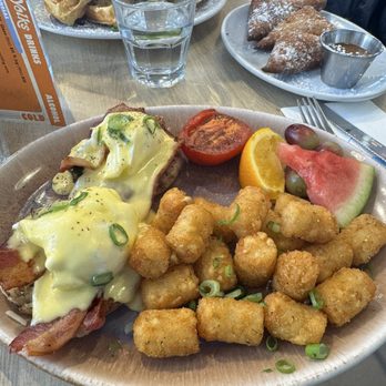 Yolks - Double-Smoked Bacon "Perfectly Poached Egg Sandwich" with a side of yolks tots - Juice Bars & Smoothies Near Me - Ottawa, Ontario Yolks - Double-Smoked Bacon "Perfectly Poached Egg Sandwich" with a side of yolks tots - Juice Bars & Smoothies Near Me - Ottawa, Ontario