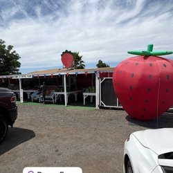 Front of the stand with the giant strawberry