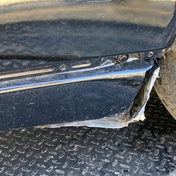 New Image Collision Center - Front right fender behind tire looks as though someone pulled this part off and could not put it back together. - Body Shops Near Me - Lithonia, Georgia New Image Collision Center - Front right fender behind tire looks as though someone pulled this part off and could not put it back together. - Body Shops Near Me - Lithonia, Georgia