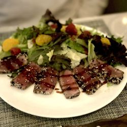 71° West Atlantic Steakhouse - Seared Tuna - $18 pan-seared sesame tuna, mixed greens red onions, grape tomatoes mandarin oranges, raspberry vinaigrette 15-year balsamic