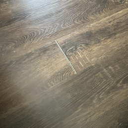 Crack in seam from plank being cut too short.