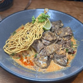 Pusadee's Garden - khao soi beef cheek, egg noodles, pickled mustard greens, red & yellow curry - Thai Near Me - Pittsburgh, Pennsylvania Pusadee's Garden - khao soi beef cheek, egg noodles, pickled mustard greens, red & yellow curry - Thai Near Me - Pittsburgh, Pennsylvania