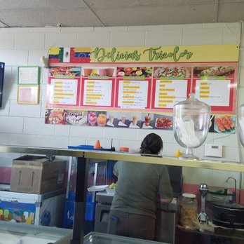 Delicious Tricolor - a woman behind the counter of a restaurant - Ice Cream & Frozen Yogurt Near Me - Indianapolis, Indiana