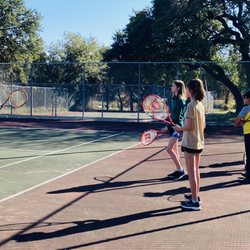 Mack Phillips Tennis Academy - Coach Alex teaching the importance of ready position.