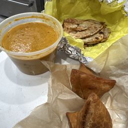 Chicken korma, one order of samosa, and one order of garlic naan.