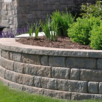 Showcase Landscaping - a stone retaining wall - Landscaping Near Me Showcase Landscaping - a stone retaining wall - Landscaping Near Me