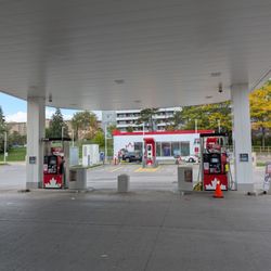 Petro-Canada - Gas pumps, with electric vehicle charging stations and a car wash in the background