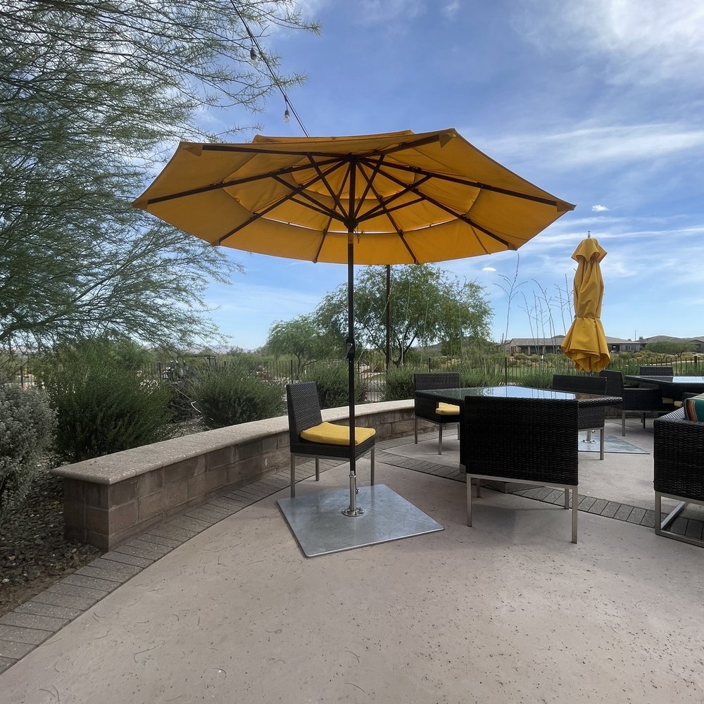 Eddy’s Poolside - a patio with a table and umbrella - Lounges Near Me - Rio Verde, Arizona Eddy’s Poolside - a patio with a table and umbrella - Lounges Near Me - Rio Verde, Arizona