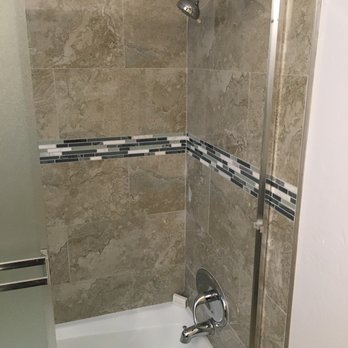 Rick Rojas Construction - a shower with a glass door - General Contractors Near Me Rick Rojas Construction - a shower with a glass door - General Contractors Near Me