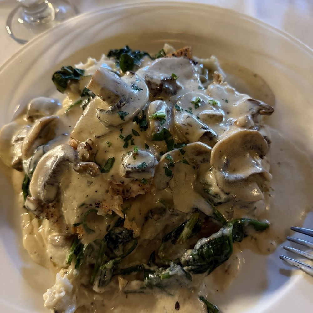 Twisted Vine Restaurant - Salmon, spinach on top of a bed of mashed potatoes with a cream sauce. - Italian Near Me - Derby, Connecticut Twisted Vine Restaurant - Salmon, spinach on top of a bed of mashed potatoes with a cream sauce. - Italian Near Me - Derby, Connecticut