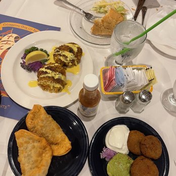 The Columbia - crab cakes, empanadas, and black bean cakes with some 1905 salad in the top plate there - Spanish Near Me - St Augustine, Florida